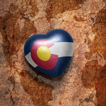 A heart shaped toy with the state of colorado on it.